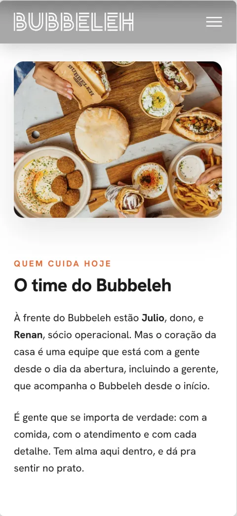 O time do Bubbeleh on a phone: who runs the place, over a photo of the spread.